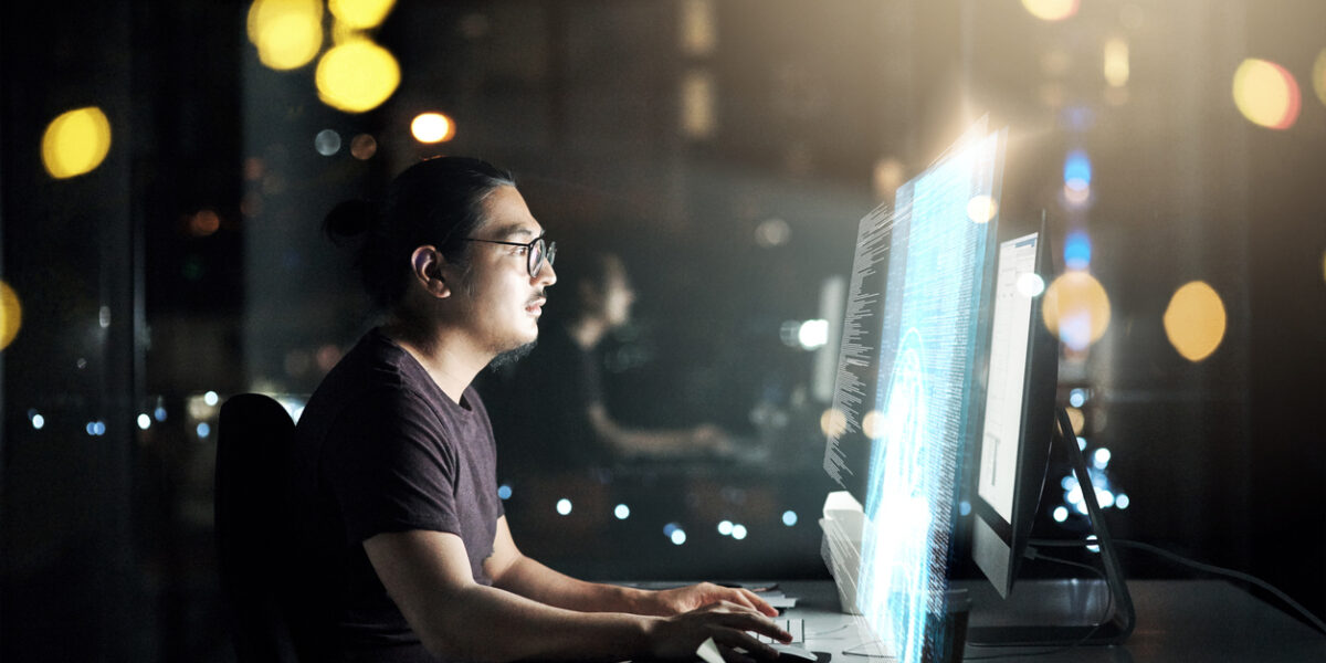 male working on computer doing desktop monitoring