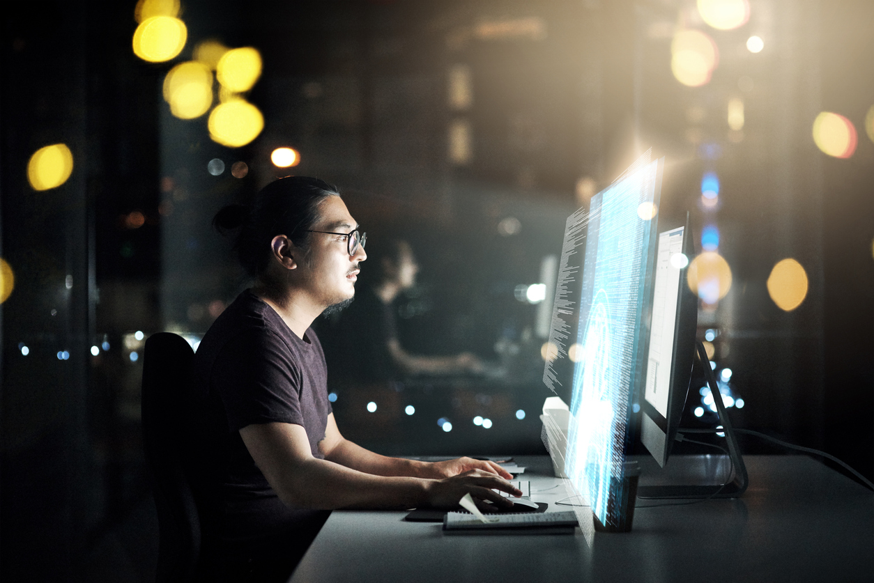 male working on computer doing desktop monitoring