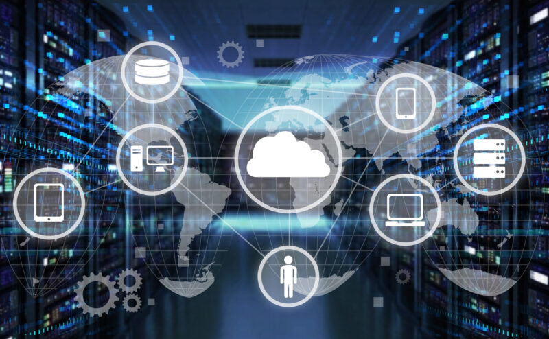 Image of computers in background with a graphic overlay with representing it solutions icons across the front.
