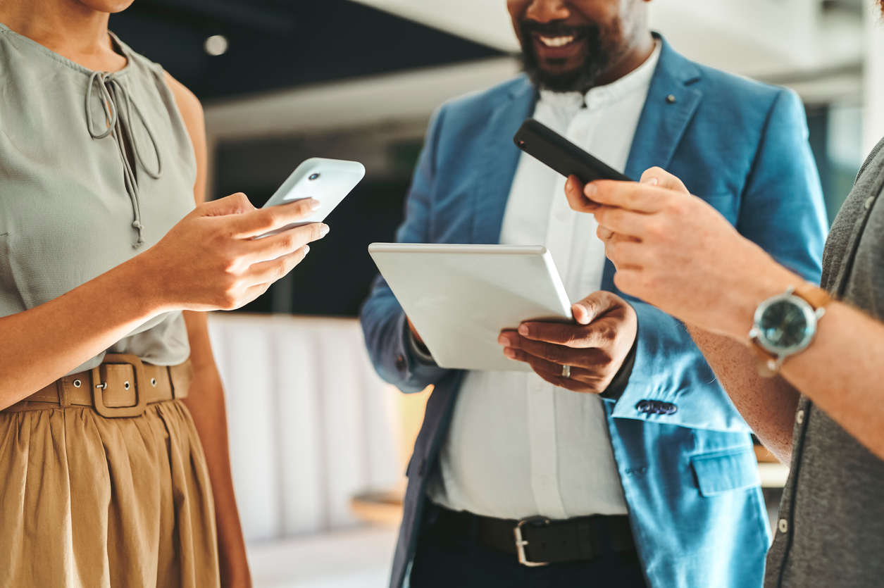 A business group connecting on their devices to their computer networking system.